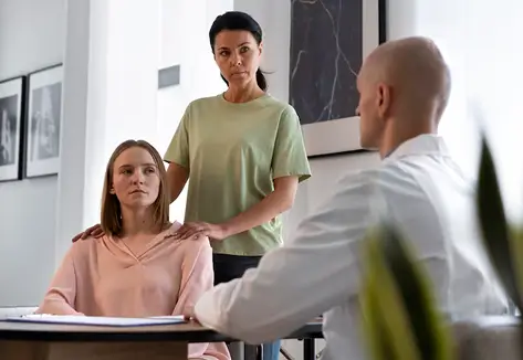 Certified sober coach in New York reviewing a personalized recovery plan with a client