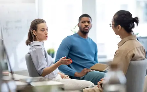 Recovery coach supporting a client through structured sober living guidance