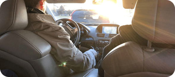 Sober escort professional accompanying a client safely to a treatment facility in New York