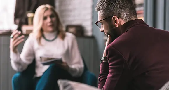 Sober coach having a one-on-one session with a recovery client in New York