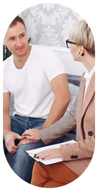 Sober coach and client in a comfortable in-person coaching session in New York