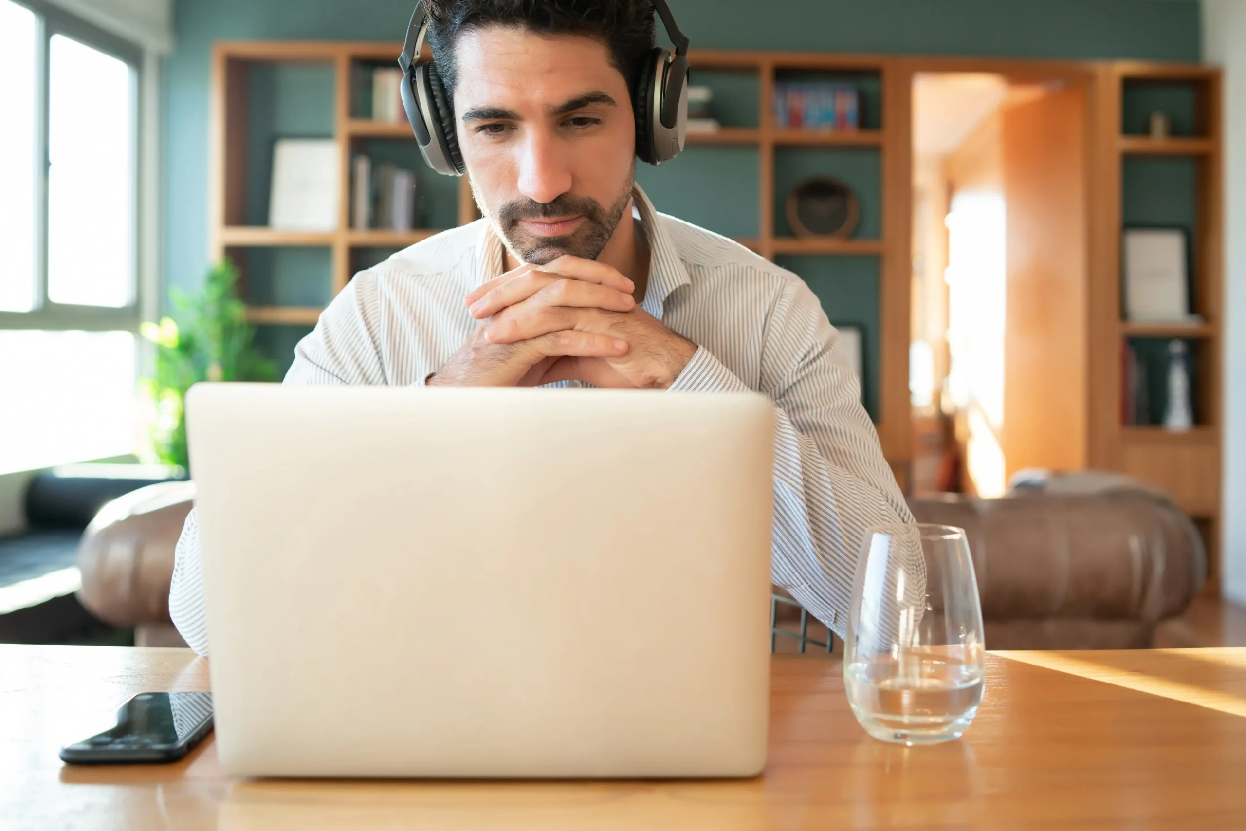 A person connecting with an online sober coach through a secure video call from home