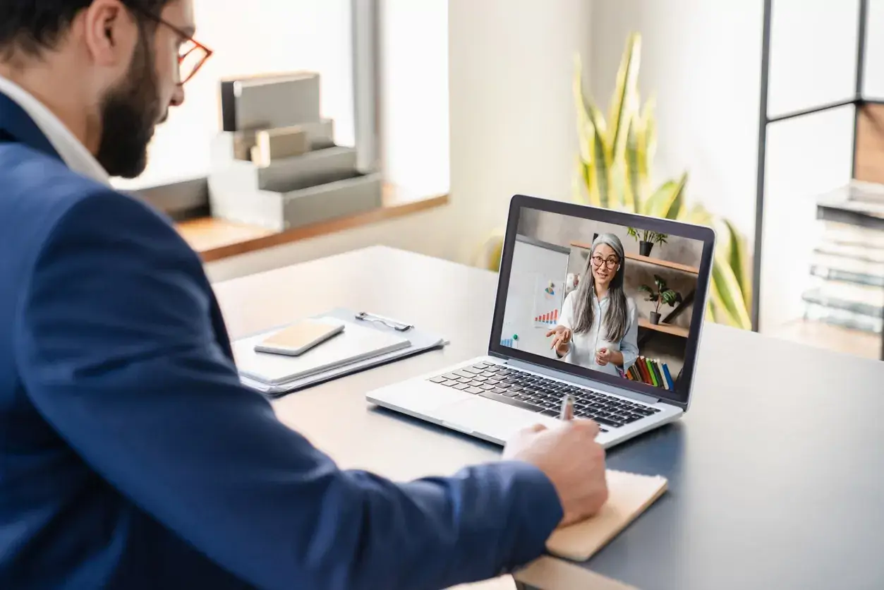 A certified sober coach conducting a confidential online sober coaching session via Zoom